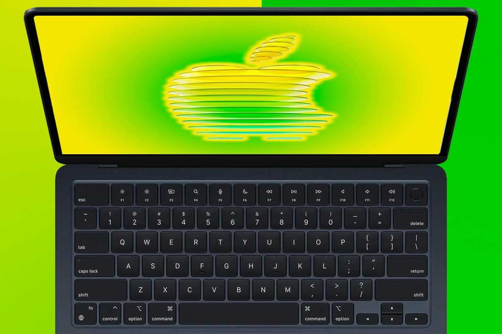 MacBook Air open with a stylized Apple logo on the screen