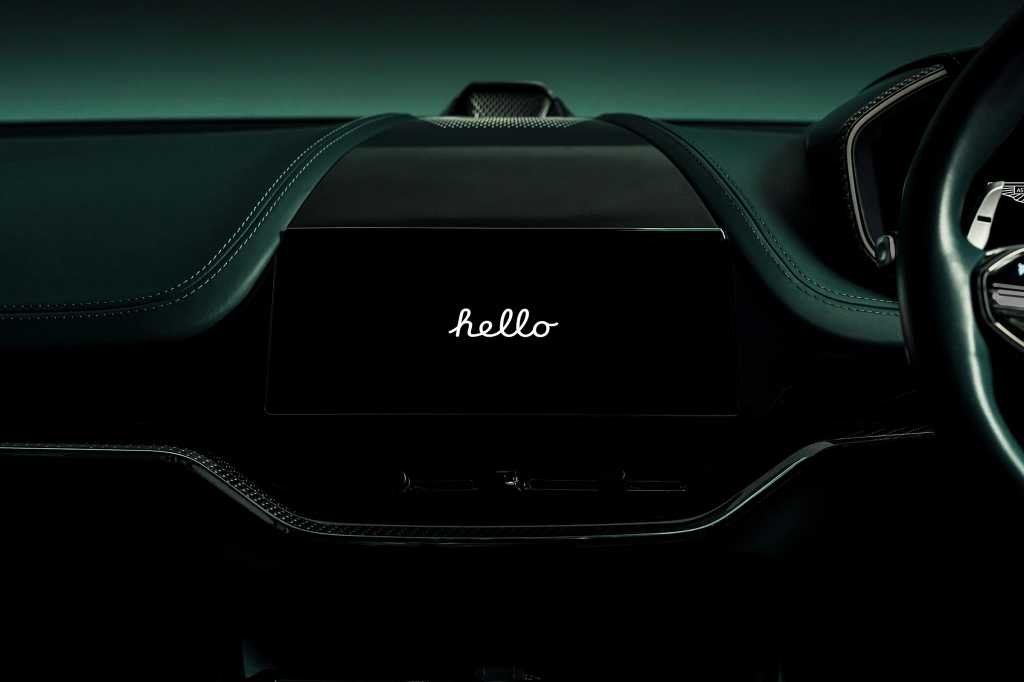 Aston Martin dashboard with Apple CarPlay Ultra saying hello
